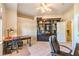 Well-lit home office with a ceiling fan, a large desk and chair, a bookshelf and a closet with double doors at 8875 Steven Chase Ct, Las Vegas, NV 89149