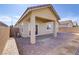 Covered back patio with a paved area ideal for relaxing or grilling at 92 Starlight Sonata Ave, Henderson, NV 89015