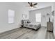 Comfortable bedroom with wood flooring, natural light, and a clean, minimalist design at 92 Starlight Sonata Ave, Henderson, NV 89015