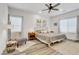 Inviting main bedroom features a ceiling fan, two windows, and neutral decor at 92 Starlight Sonata Ave, Henderson, NV 89015