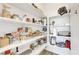 Walk-in pantry with shelving, providing ample storage space for food and kitchen essentials at 92 Starlight Sonata Ave, Henderson, NV 89015