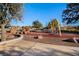 Community playground with swings, rock structures, and open space for recreational activities on a sunny day at 92 Starlight Sonata Ave, Henderson, NV 89015