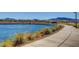 Beautiful pond with walking path, landscaping and mountain views at 92 Starlight Sonata Ave, Henderson, NV 89015