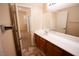 Bathroom with single vanity and access to bedroom at 9408 Forest Edge Ave, Las Vegas, NV 89149