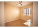 Bright bedroom featuring a ceiling fan and large window at 9408 Forest Edge Ave, Las Vegas, NV 89149