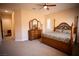 Bright bedroom with a large bed, dresser, and carpet flooring at 9408 Forest Edge Ave, Las Vegas, NV 89149