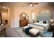 Elegant bedroom with a tufted headboard and plenty of light at 9408 Forest Edge Ave, Las Vegas, NV 89149