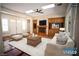 Bright living room with a fireplace and built-in entertainment center at 9408 Forest Edge Ave, Las Vegas, NV 89149