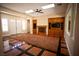 Spacious living room with a fireplace and large windows at 9408 Forest Edge Ave, Las Vegas, NV 89149