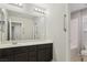 Bathroom boasts a double vanity and an adjacent shower/tub combo at 9875 Vista Meadows Ave, Las Vegas, NV 89148