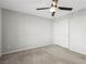 Well-lit bedroom featuring ceiling fan and sliding door closet at 9875 Vista Meadows Ave, Las Vegas, NV 89148