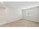 Simple bedroom with neutral walls and carpet flooring at 9875 Vista Meadows Ave, Las Vegas, NV 89148