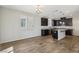 Modern kitchen with dark cabinetry, granite countertops, and stainless steel appliances at 9875 Vista Meadows Ave, Las Vegas, NV 89148