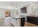 Spacious kitchen with island, granite countertops and stainless steel appliances at 9875 Vista Meadows Ave, Las Vegas, NV 89148