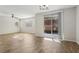 Bright living room featuring tile floors and sliding glass doors to backyard at 9875 Vista Meadows Ave, Las Vegas, NV 89148