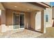 Covered patio with brick pavers and sliding glass door at 9875 Vista Meadows Ave, Las Vegas, NV 89148