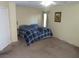 Main bedroom with large bed and neutral decor at 10046 Daybreak Dew Ct, Las Vegas, NV 89183