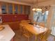 Bright dining area with wood table and chairs, and built in cabinets at 10046 Daybreak Dew Ct, Las Vegas, NV 89183