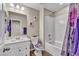 Well-lit bathroom with a vanity, toilet and bathtub at 10211 Starlit Canyon Ct, Las Vegas, NV 89141