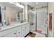 Double vanity bathroom with a large walk-in shower at 10211 Starlit Canyon Ct, Las Vegas, NV 89141