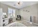 Bright bedroom with a vanity, window seat, and modern decor at 10211 Starlit Canyon Ct, Las Vegas, NV 89141