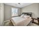 Comfortable bedroom featuring a queen-size bed and neutral tones at 10211 Starlit Canyon Ct, Las Vegas, NV 89141