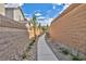 Landscaped pathway with retaining walls, leading through the community at 10211 Starlit Canyon Ct, Las Vegas, NV 89141