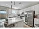 Modern kitchen with stainless steel appliances and an island at 10211 Starlit Canyon Ct, Las Vegas, NV 89141