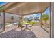 Covered patio with a table and chairs, ideal for outdoor dining at 10211 Starlit Canyon Ct, Las Vegas, NV 89141