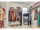 Spacious walk-in closet with ample shelving and hanging rods at 10211 Starlit Canyon Ct, Las Vegas, NV 89141