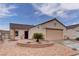 Attractive single-story home boasting desert landscaping, a terra cotta roof, and an attached two-car garage at 1073 Silver Bullet Ct, Henderson, NV 89011