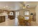 Open kitchen and dining area featuring granite countertops, white appliances, and sliding door to the back at 1073 Silver Bullet Ct, Henderson, NV 89011