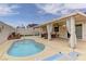 Inviting pool with covered patio, curtains, ceiling fan, and outdoor seating at 1073 Silver Bullet Ct, Henderson, NV 89011