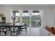 Dining area with view of backyard through sliding glass doors at 11671 Hatchling Ave, Las Vegas, NV 89138