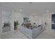 Living room with sectional sofa and kitchen view at 11671 Hatchling Ave, Las Vegas, NV 89138