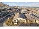 Aerial view of a modern suburban home with a manicured front yard and a two-car garage at 11900 Star Grass Ave, Las Vegas, NV 89138