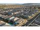 High up aerial shot of a suburban neighborhood showing many single Gathering homes at 11900 Star Grass Ave, Las Vegas, NV 89138