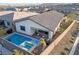 Aerial view showcasing a pool, spa, outdoor seating, and meticulously landscaped backyard of the home at 11900 Star Grass Ave, Las Vegas, NV 89138