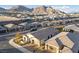 Wide aerial view of a suburban neighborhood showcasing modern homes with well maintained landscapes at 11900 Star Grass Ave, Las Vegas, NV 89138