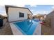 Inviting backyard pool with a spa and basketball hoop, perfect for relaxation and fun at 11900 Star Grass Ave, Las Vegas, NV 89138