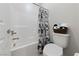 Bright bathroom featuring a shower-tub combo, stylish decor, and ample space at 11900 Star Grass Ave, Las Vegas, NV 89138