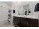 Elegant bathroom featuring a double vanity and tiled shower-tub combo at 11900 Star Grass Ave, Las Vegas, NV 89138