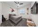 bedroom featuring a playful superhero theme, modern decor, and ample natural light at 11900 Star Grass Ave, Las Vegas, NV 89138