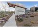 Savannah community entrance with stone accents and manicured landscaping at 11900 Star Grass Ave, Las Vegas, NV 89138