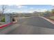 Gated community entrance with well-maintained landscaping at 11900 Star Grass Ave, Las Vegas, NV 89138