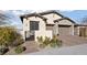 Well-maintained single-story home with a two-car garage and beautifully landscaped front yard at 11900 Star Grass Ave, Las Vegas, NV 89138