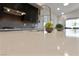 Bright kitchen countertop with stylish faucet and views of living area and backyard at 11900 Star Grass Ave, Las Vegas, NV 89138