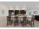 Bright kitchen featuring a large island with seating, pendant lights, stainless appliances and ample counter space at 11900 Star Grass Ave, Las Vegas, NV 89138