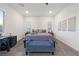 Bedroom features neutral tones, large windows, modern art, and ample space, creating a serene atmosphere at 11900 Star Grass Ave, Las Vegas, NV 89138