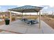 Community picnic area featuring covered picnic tables and desert landscaping at 11900 Star Grass Ave, Las Vegas, NV 89138